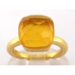 A citrine dress ring, in the style of Pomellato, the facetted cushion shaped stone 10.9mm, the