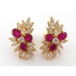 A pair of Italian ruby and diamond ear clips, each spray cluster set with central brilliant