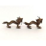 A pair of Chinese Export silver dragon menu holders, marked Ye Ji in Chinese characters and "85"