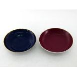 Two Chinese ceramic dishes, one ruby glazed, mark of Yongzheng, Qing period, the other aubergine