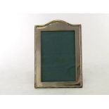 A Chinese Export silver photograph frame by Wang Hing of Canton & Hong Kong, circa 1910, plain