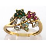 A diamond and gem set ring, the giardinetto style bezel set overall with small rubies, emeralds,