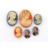 A 1970s oval shell cameo, depicting a woman in profile, 2.9cm long, unmounted, together with three