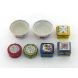 Four Limoges small ceramic boxes, two circular, one puce, one green, and two square, one yellow, one