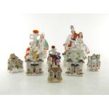 A collection of eight 19th. century and later Staffordshire flatback ceramic figures and spill