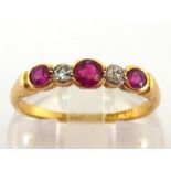 An early 20th century ruby and diamond five stone ring, composed of graduated alternate round cut