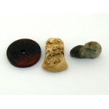 Three Chinese jade carvings in the Ming style, one brown jade plaque carved in “Bi” shaped with