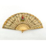 A hand painted muslin or silk fan with bone sticks and guards, carved and gilt, in original box with