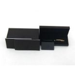 Alfred Dunhill, a metallic black resin fountain pen, with fine nib and cartridge filler mechanism (