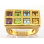 A French gentleman's multi-gem dress ring, the rectangular bezel set with pairs of square cut