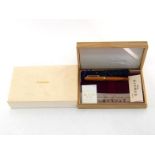 Platinum Japan, a wooden fountain pen, with fine nib and cartridge filler, in its box with