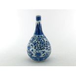 A Chinese blue and white gall- bladder shaped bottle, decorating lotus and birds on the body. Kangxi