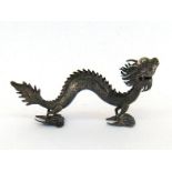 A Chinese Export silver dragon menu holder, mark of TS90 and Chinese character marks for Ti Xing (