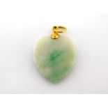 A jade pendant, the heart shaped pendant 2.7cm long, with gold fittings (tests 22 carat), 5.6gms