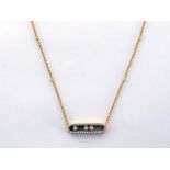 MESSIKA, 'Baby Move', an 18 carat gold and diamond necklace, the central open work oval pendant with