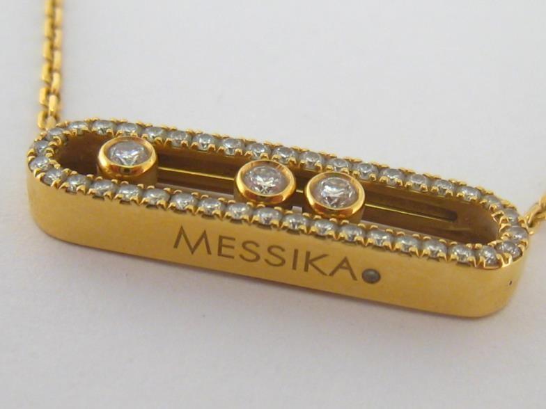 MESSIKA, 'Baby Move', an 18 carat gold and diamond necklace, the central open work oval pendant with - Image 3 of 5