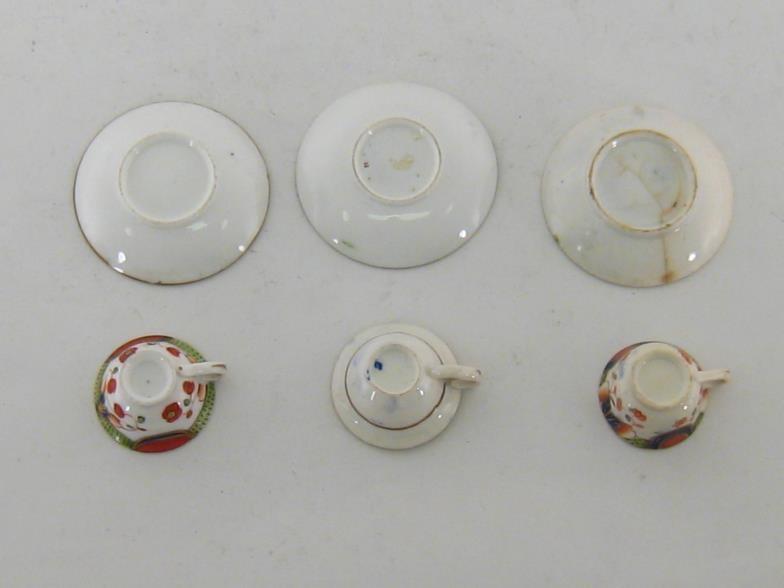 Three 19th. century miniature cups and saucers in the Crown Derby palette, unmarked apart from one - Image 3 of 6