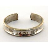 Tiffany & Co, a silver bangle, dated 1997, signed, 5.5cm inner diameter, 34.6gms