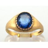 A gentleman's sapphire dress ring, the interesting oval mixed cut stone 7.9 x 7.4 x 4.2mm, mounted