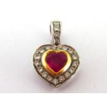 A ruby and diamond heart pendant, the central heart cut stone approx. 0.60 carat, rub over set in