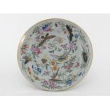 A Chinese ceramic famille-rose plate with gilt rim, finely decorated with flowers, insects and