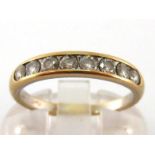 An eight stone diamond ring, the uniform channel set brilliants totalling approx. 0.40 carat, the