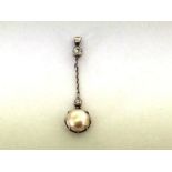 A mabe pearl and diamond pendant, circa 1915, the hemispherical pearl drop 9.7mm diameter, an old