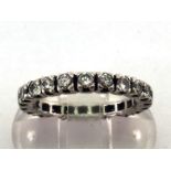 A diamond eternity ring, composed of 22 brillliants, totalling approx. 0.88 carat, mounted in