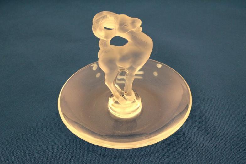 A Lalique ring dish with opaque mountain goat centre figure , the base etched “ Cristal Lalique”.