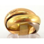 Cartier, an 18 carat three colour gold 'Trinity' ring, signed and numbered '2824', finger size N/