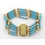 A cultured pearl and blue enamel bracelet, composed of five chains set with round 3.6mm pearls, with