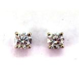 A pair of single stone diamond ear studs, the brilliants each approx. 0.50 carat, mounted in 18