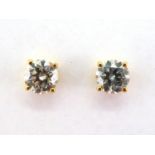 A pair of single stone diamond ear studs, the brilliants each approx. 0.6 carat, mounted in 18 carat