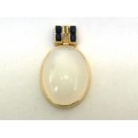 A diamond, sapphire and moonstone pendant, the large oval cabochon cut moonstone 31 x 24mm, to a two