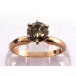 A single stone fancy coloured diamond ring, the champagne coloured (untested) brilliant approx. 0.90