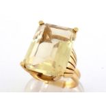 A citrine dress ring, the large rectangular mixed cut 18 x 13 x 7.6mm, mounted in yellow metal (