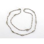 A diamond necklace, set along its length with collet set brilliants, the white metal (tests 18 carat