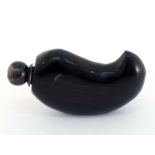 A carved boteh-shaped dark horn container, the two part turned horn stopper with metal screw