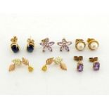 A collection of five pairs of ear studs, including a cultured pearl set example, a pair of