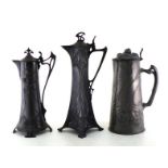 Three lidded pewter jugs in the Art Nouveau/ Jugendstil manner; one by “Osiris” with strawberries