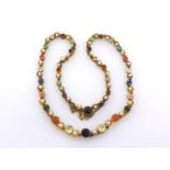 A fine Victorian multi gem necklace, set along its length with graduated stones, respectively