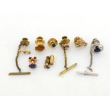 A collection of gem set dress studs, including sapphire, ruby, emerald, diamond, citrine and