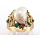 A 1970s baroque pearl, diamond and emerald dress ring, the central baroque pearl 12mm long, above