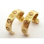 A pair of yellow metal hoop earrings, stamped to inner hoop '14k',