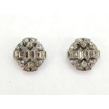 A pair of Art Deco diamond ear studs by Van Cleef and Arpels, the small circular studs set overall