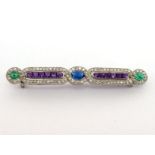 A fine early 20th century diamond, emerald, amethyst and sapphire bar brooch (possibly