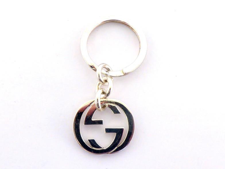 GUCCI, a silver keyring, with Gucci logo, 23.5gms