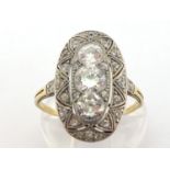 An Art Deco diamond plaque ring, the vertical panel set with three principal old and transition