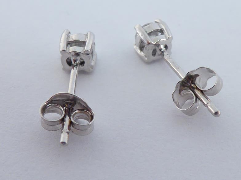 A pair of 18 carat white gold and single stone diamond ear studs, each brilliant approx. 0.12 carat, - Image 3 of 3