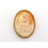 A shell cameo brooch, the large oval cameo depicting Erato, 48mm long, in a gold rope twist